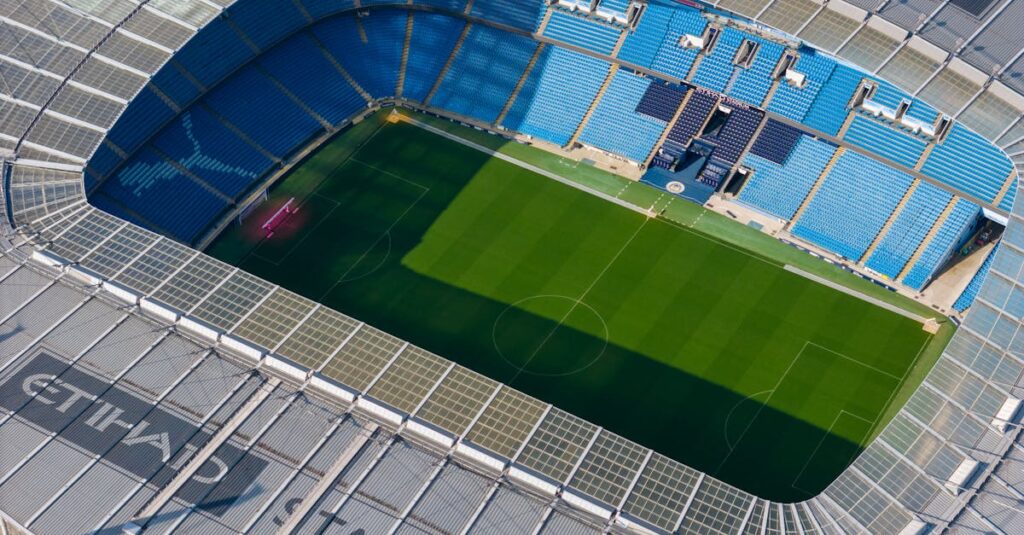 Stunning aerial shot capturing the modern architecture of Etihad Stadium in Manchester.